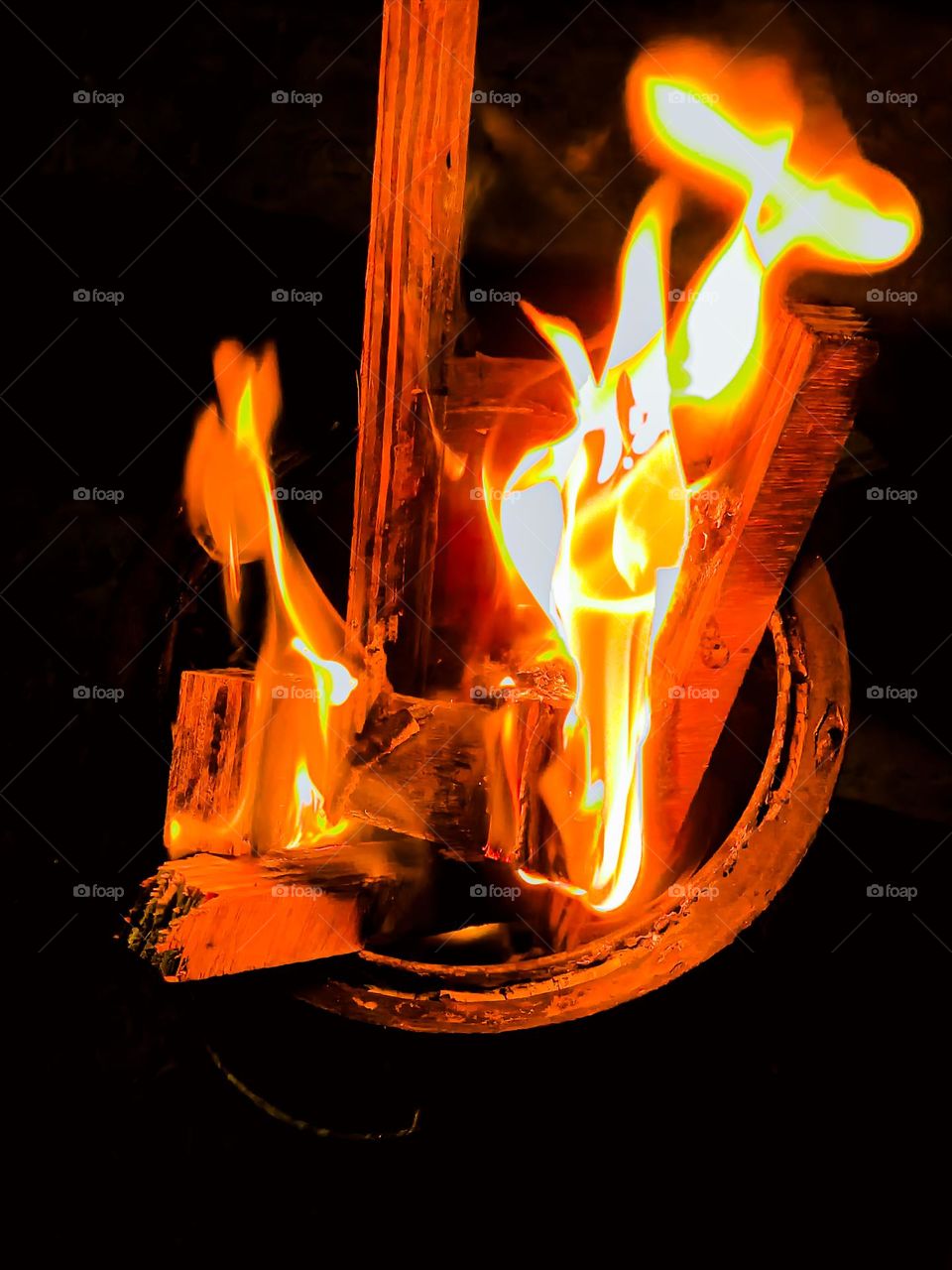 The flame photo , in winters people find different ways to warm them up