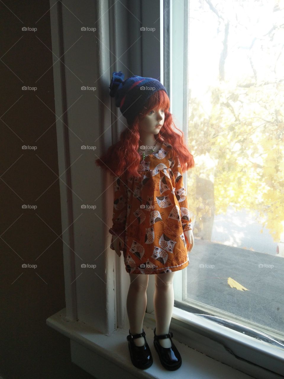 Doll Next to Window