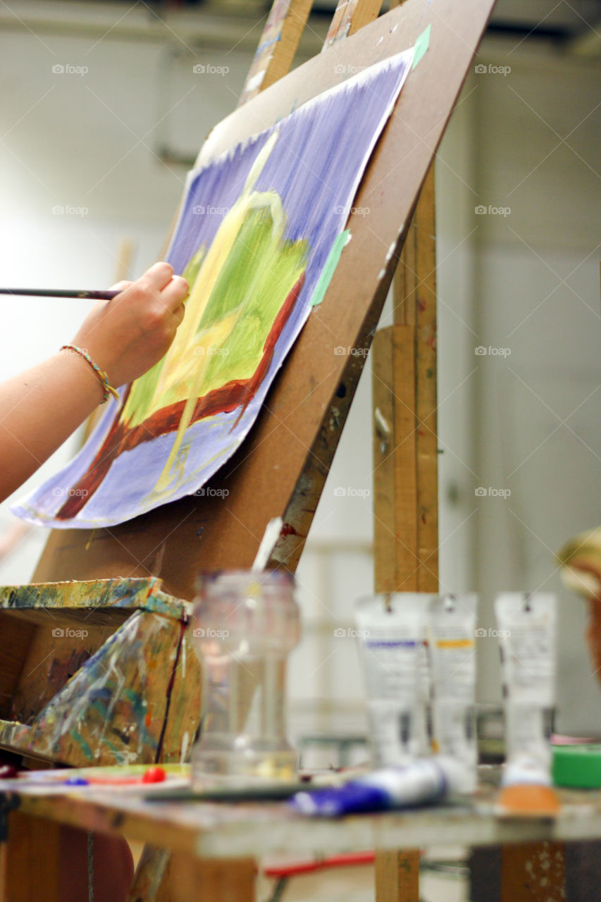 An artist paints in the studio 