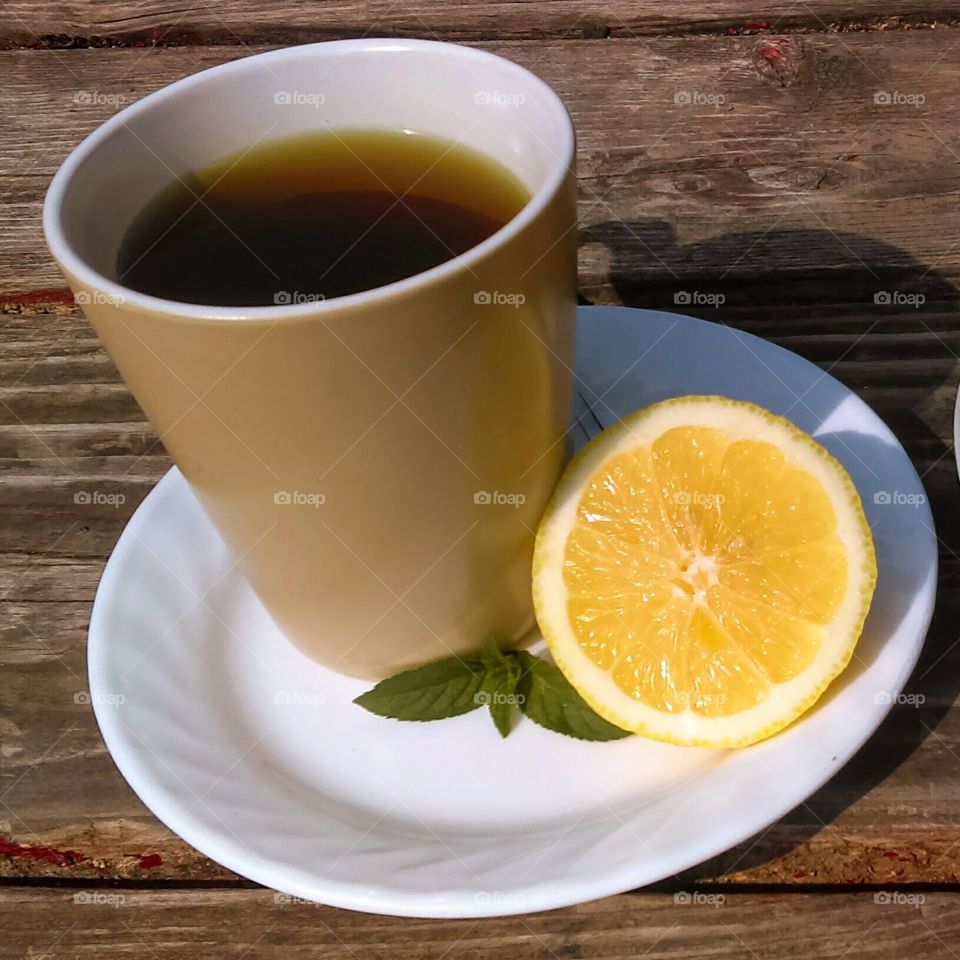 Morning cup of tea with lemon