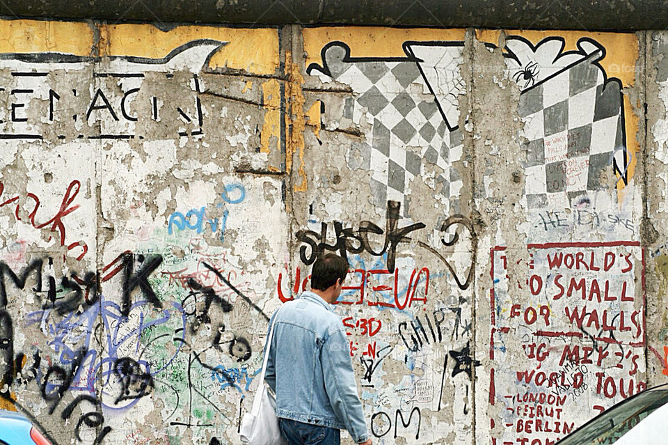 Standing by the wall in Berlin