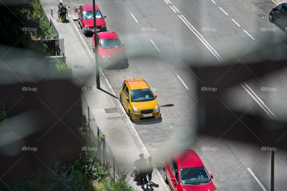 View of a yellow car from a terrace