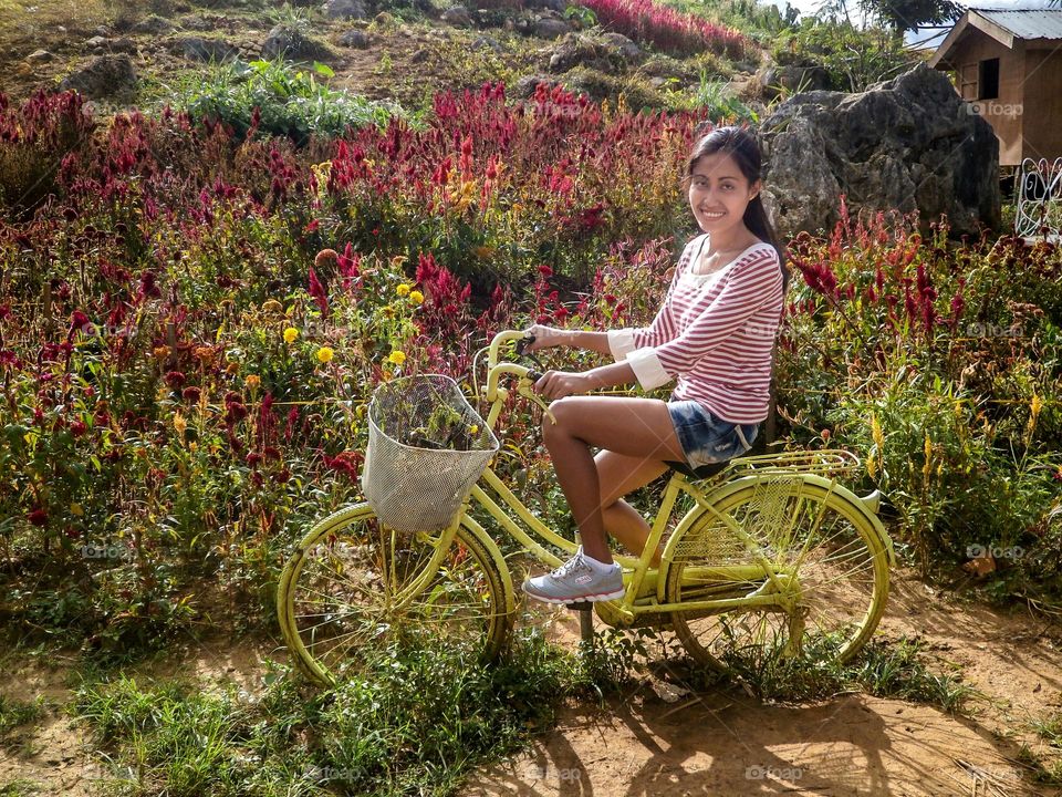 Smiling woman riding on a bike