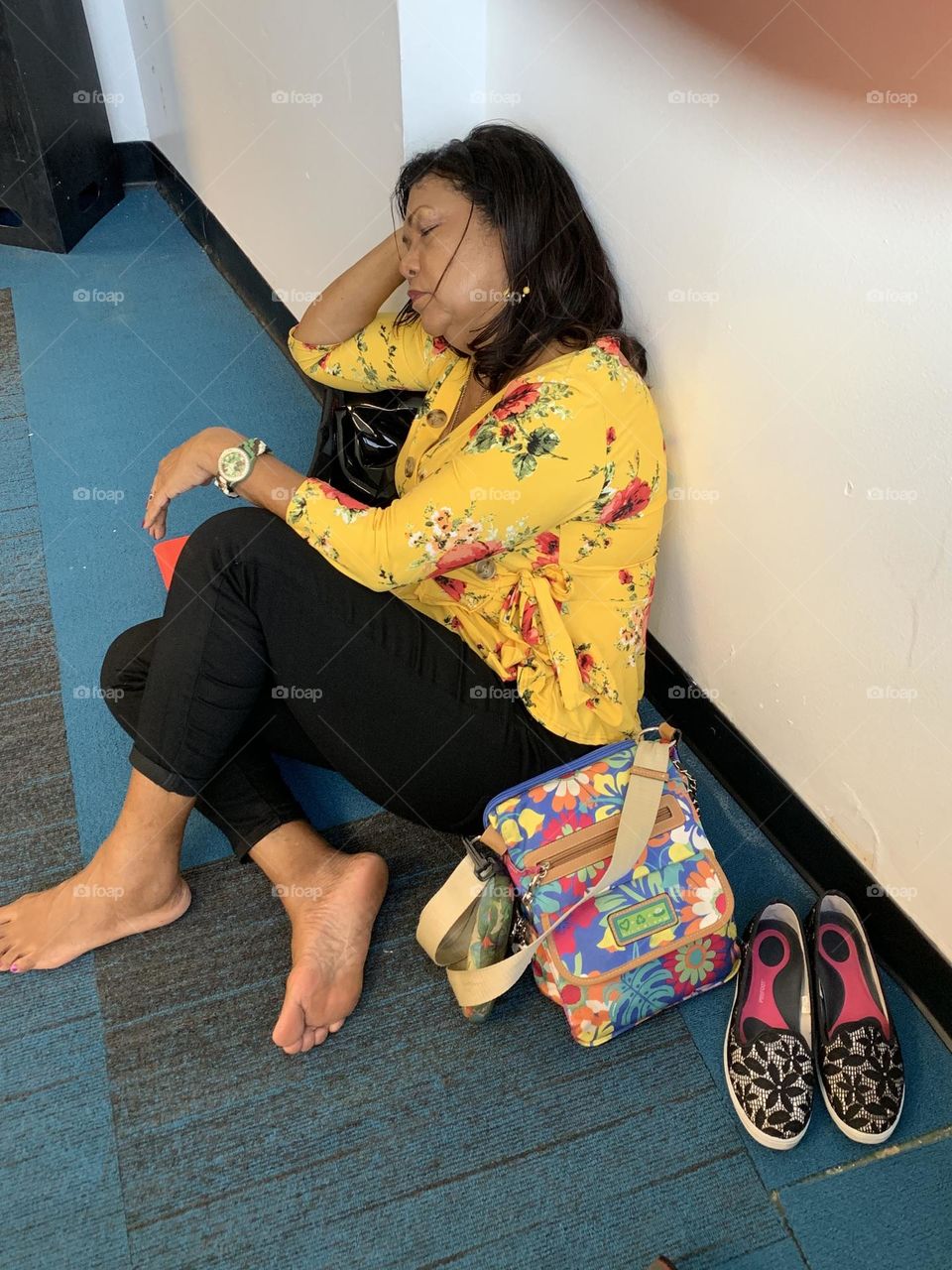 Airports - As much as I dread the airport overnight I cannot help but be amused by everyone sleeping anywhere they can find at the airport. This lady waited as long as she could before her eyelids were so heavy she just decided to sleep on the floor.