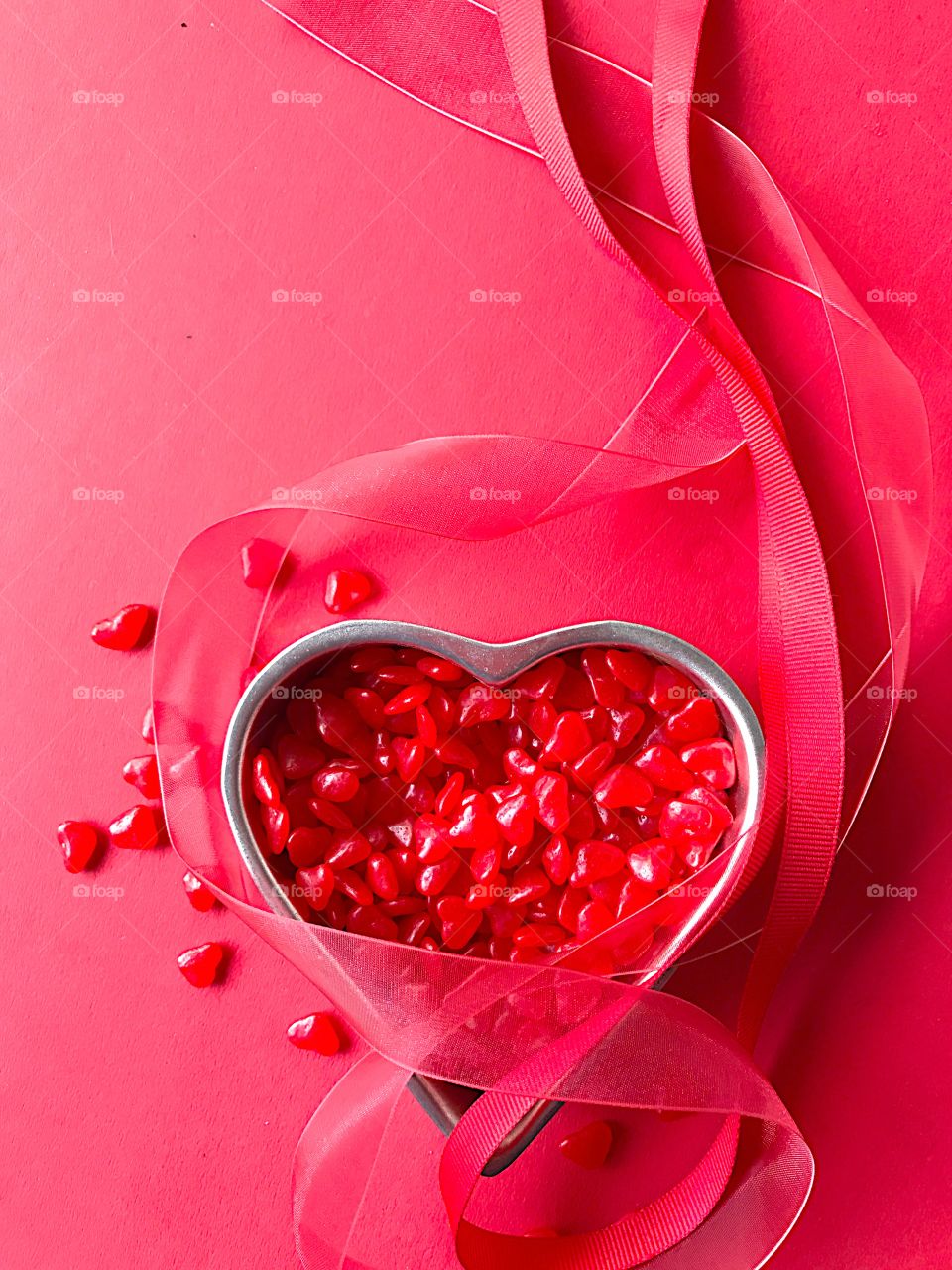 Red heart candy with ribbons