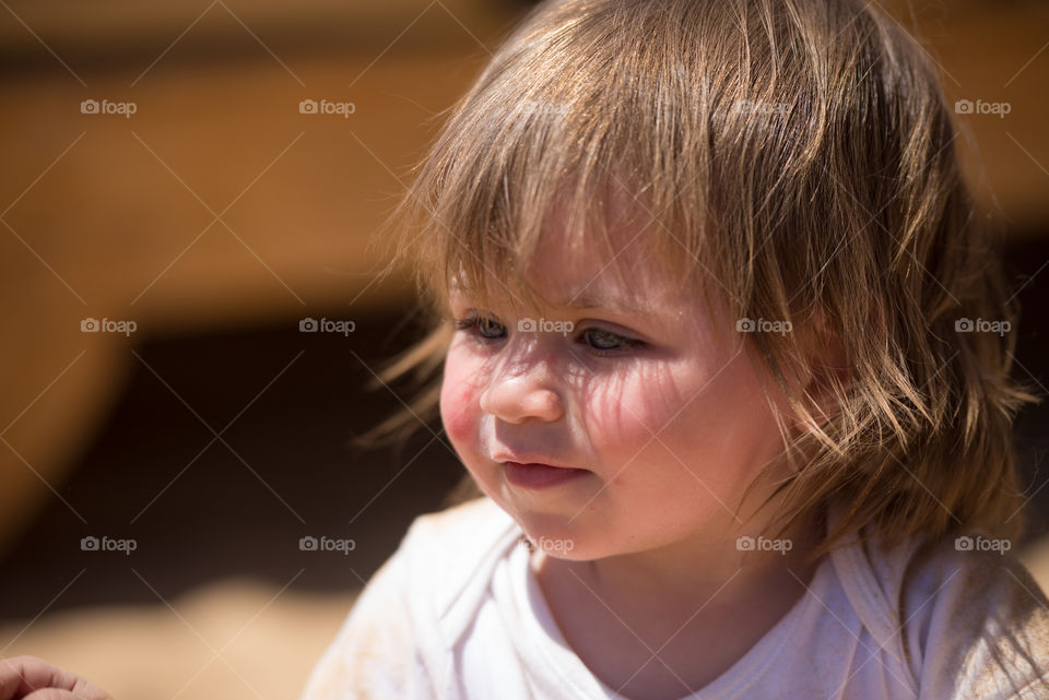 blond baby under the sun light