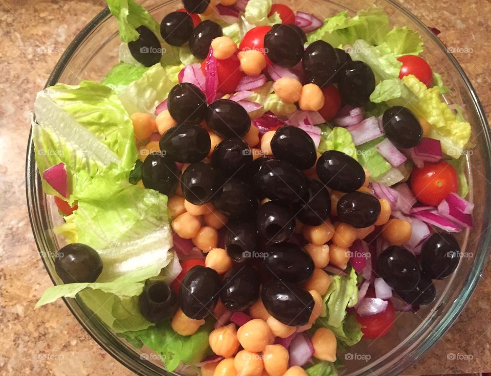 Olives in a salad. A fresh salad filled with olives