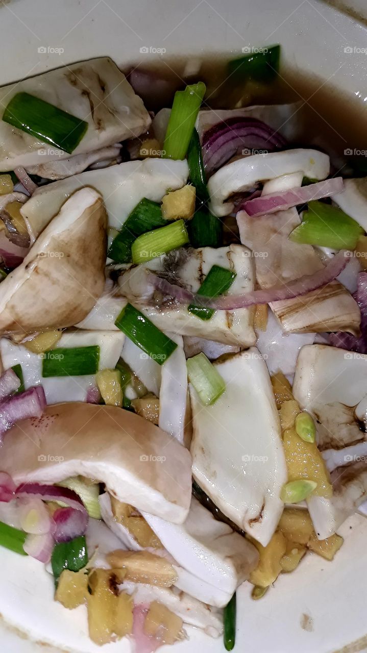 Fresh squid salad, in coconut water vinegar, kalamansi, red onions, spring onions and ginger.