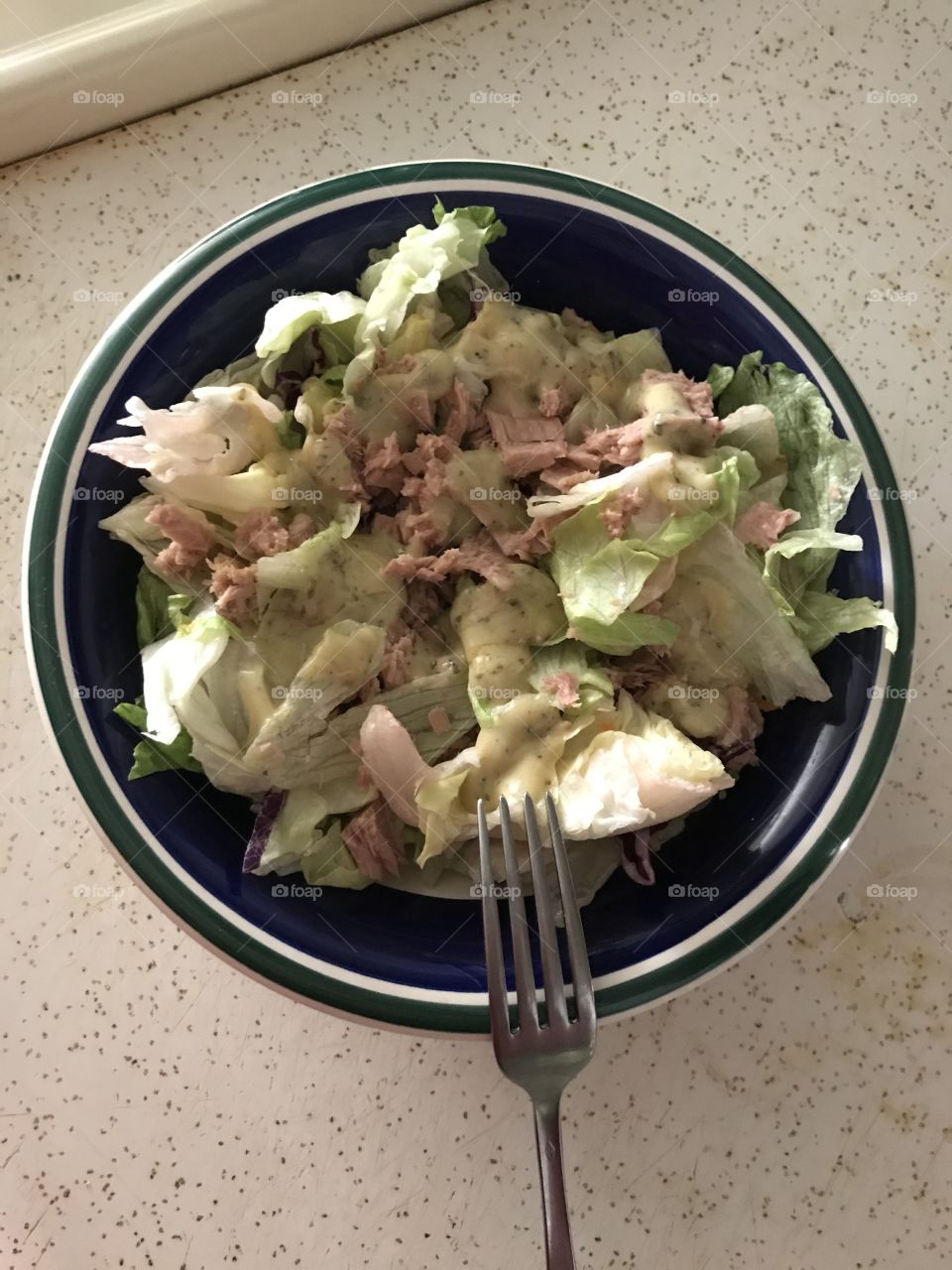 Tuna salad. It is a healthy and smart way to eat. The sight of it would give one the desire to taste it.