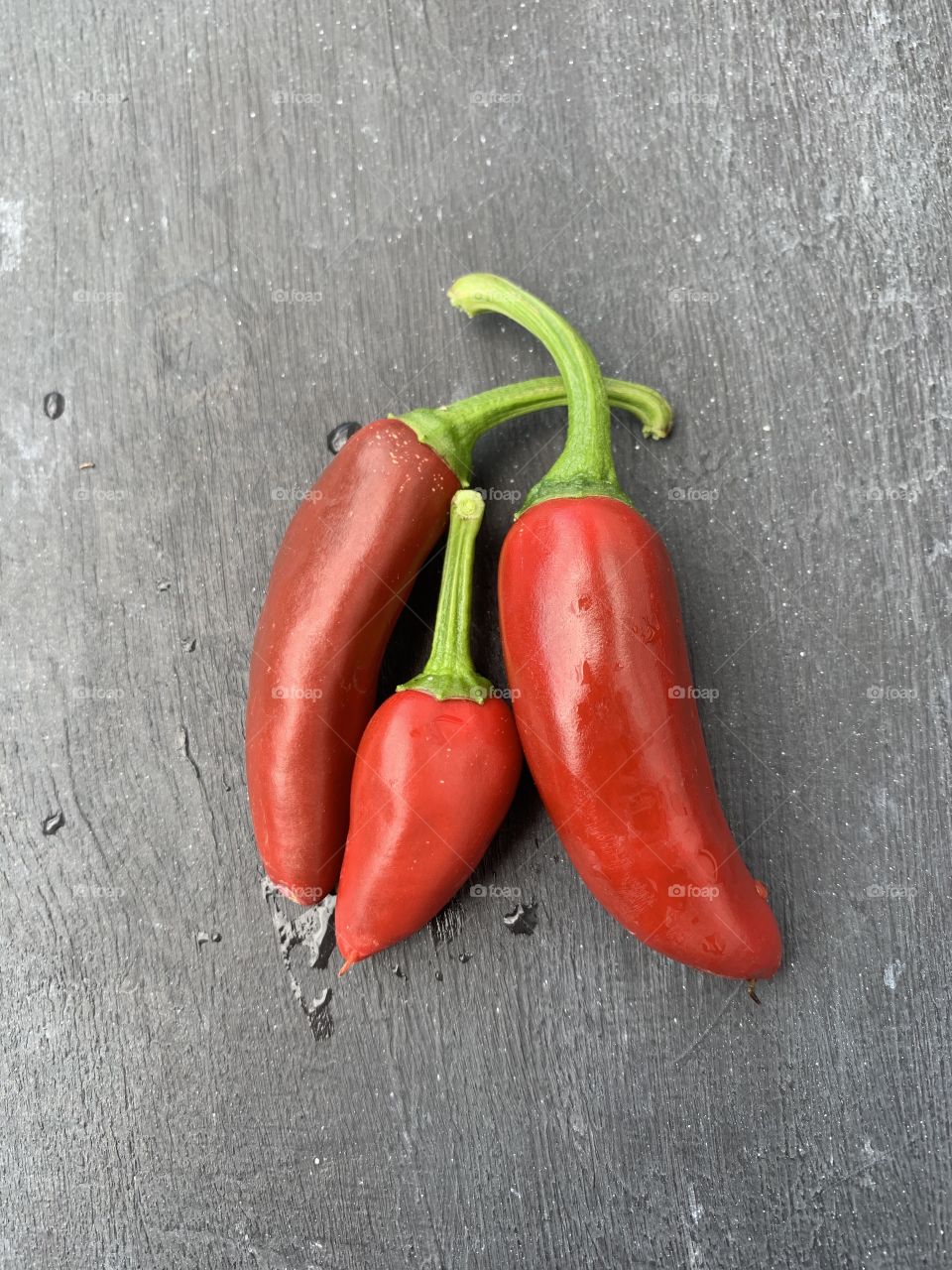 Three ripe red chillis