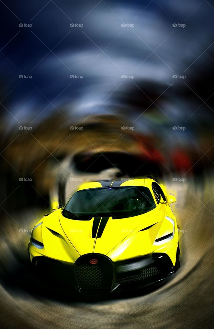 Cars.  Yellow
 Bugatti Divo on blurred colorful background