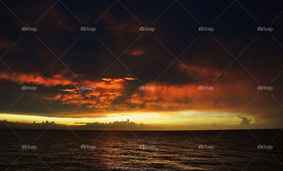 FIERY. (Montego Bay, Jamaica). Photo taken in a beach on Montego Bay whilst looking out at the colourful sunset