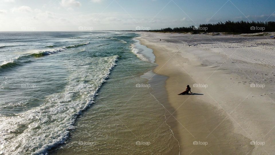 Top view of the beach, the ocean and the cliffs of Arraial do Cabo in Brazil. Beautiful colorful scenes