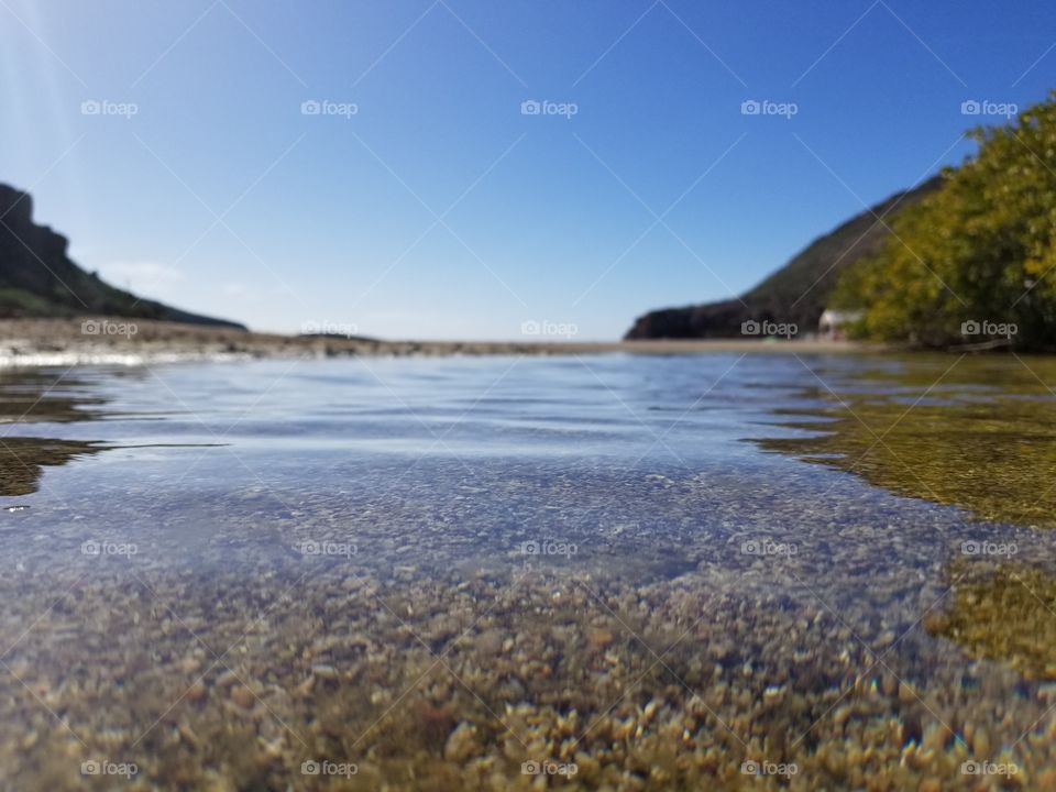 estuary looking out to mountains and ocean