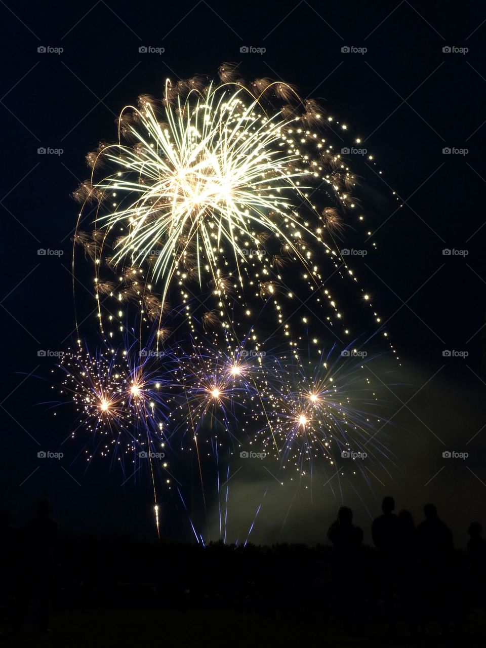 In France, the July 14 firework celebrates the national day and bring the French together around festivities. This photograph was taken in 2023 in a small town.