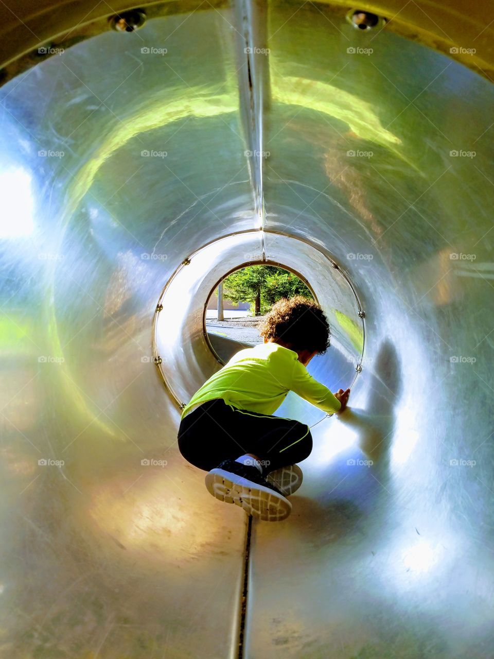 Kid In Tunnel At The Park