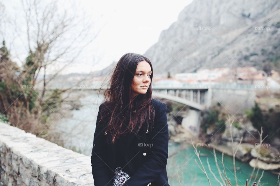 Portrait of a woman in front of mountain