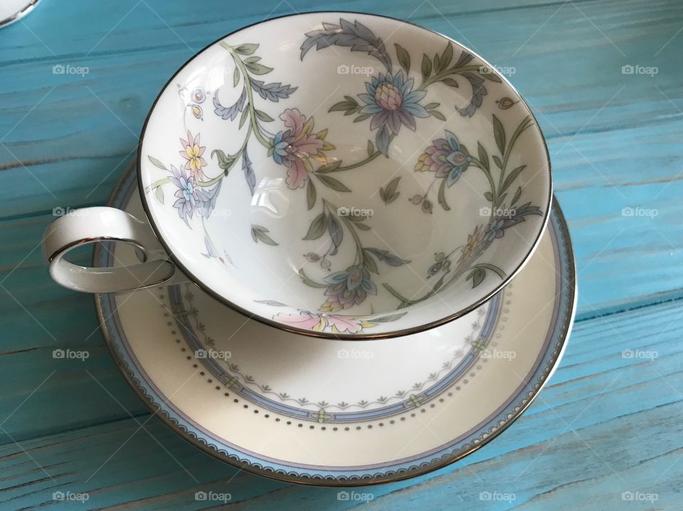 Elegant cup with a saucer in blue