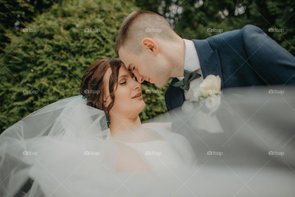 Photo session of the bride and groom in nature