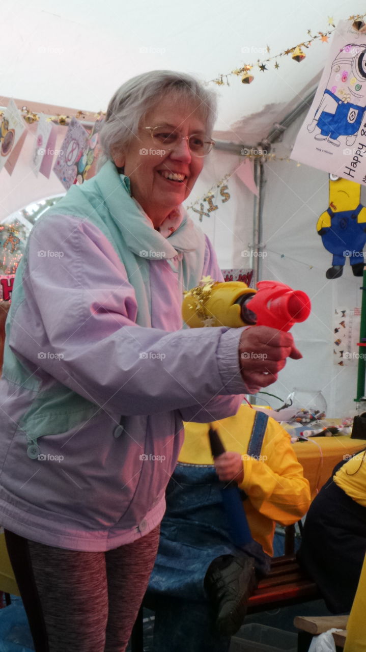 grandma playing games at a children's party