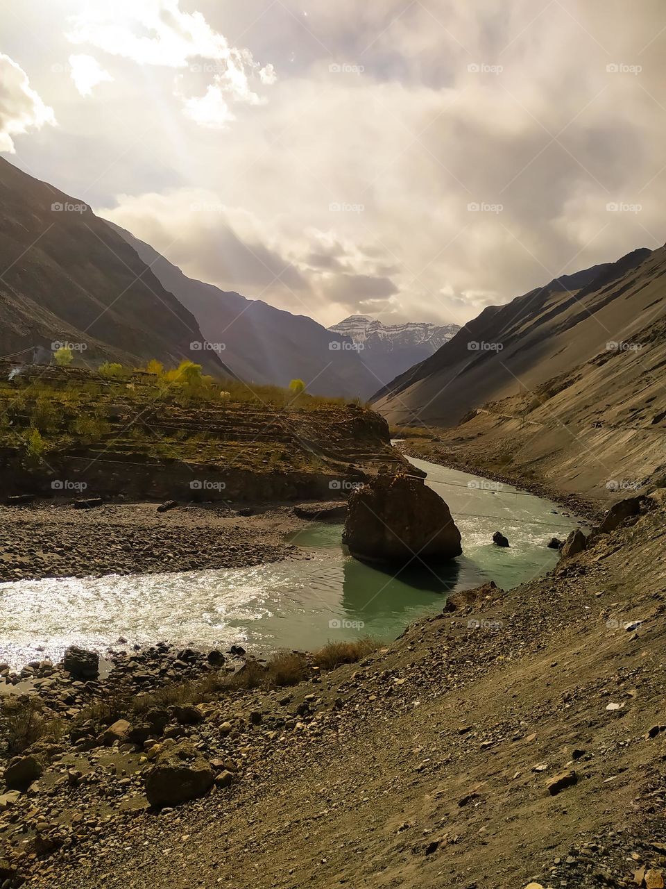 landscape with high Himalayan mountains. beautiful curving river. with clouds at sunset in summer in India . mountain valley, Travel Himalayas