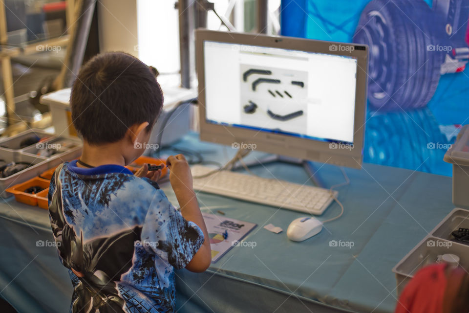 kid working on computer