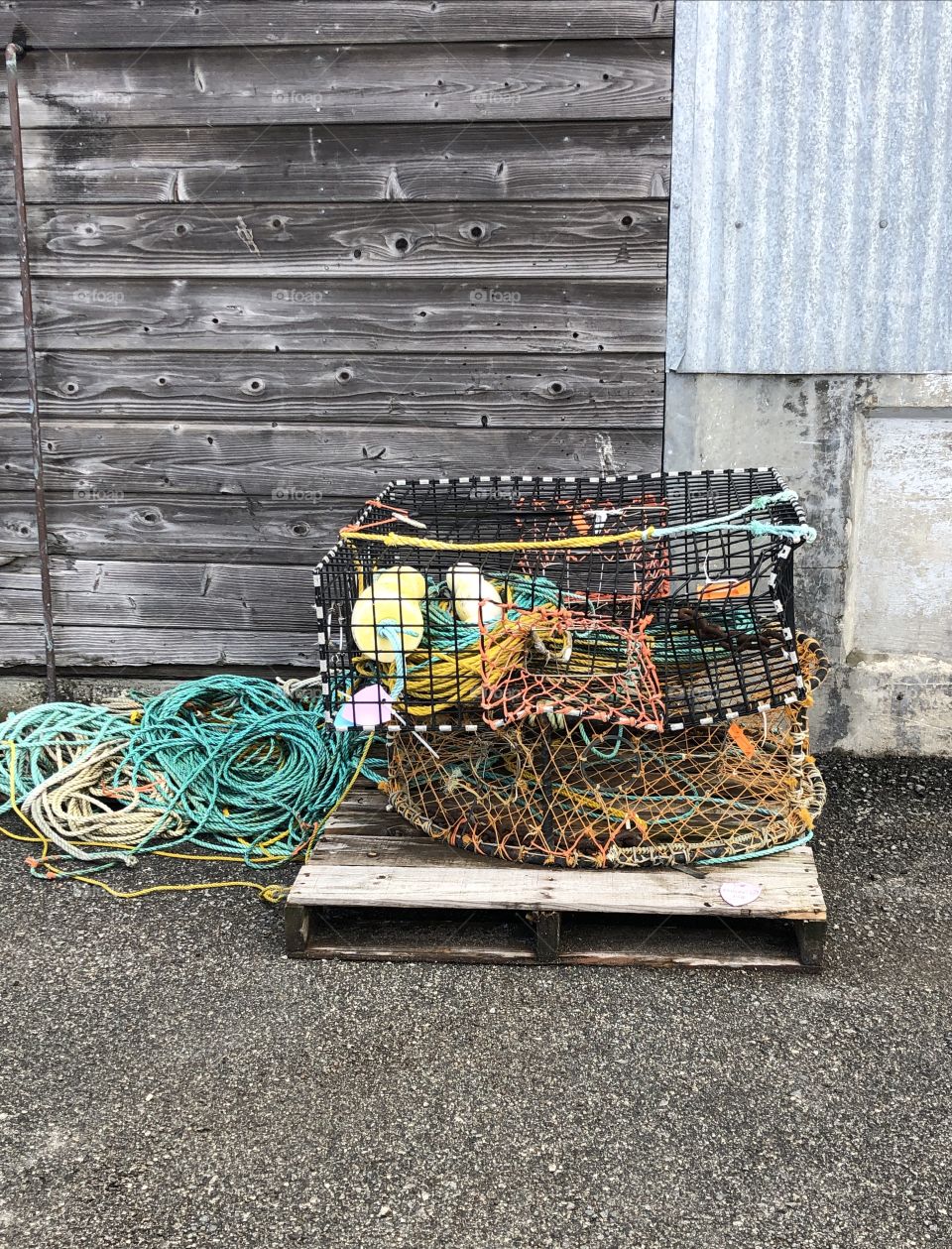 crab fishing cage alongside a fish market that on a pier in Monterey. The market was clised for the day and thus was just left there.