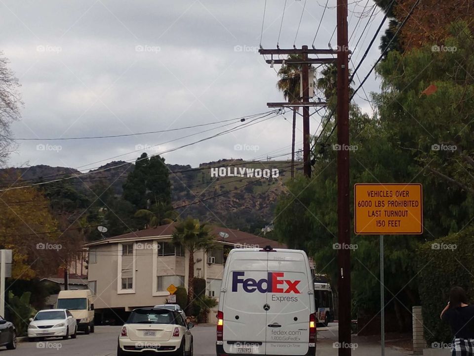 Hollywood sign viewed from a private neighborhood in Hollywood California on a smoggy day
