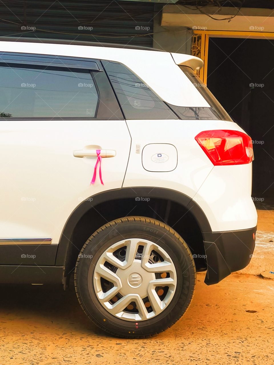 A new Black and White car having components of other colors.