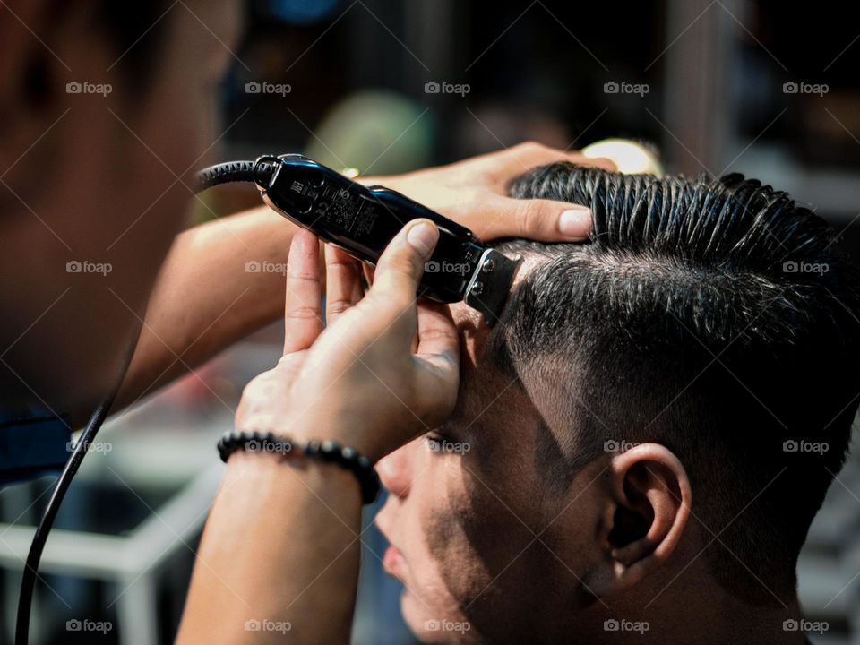 Having a haircut at a friend’s salon