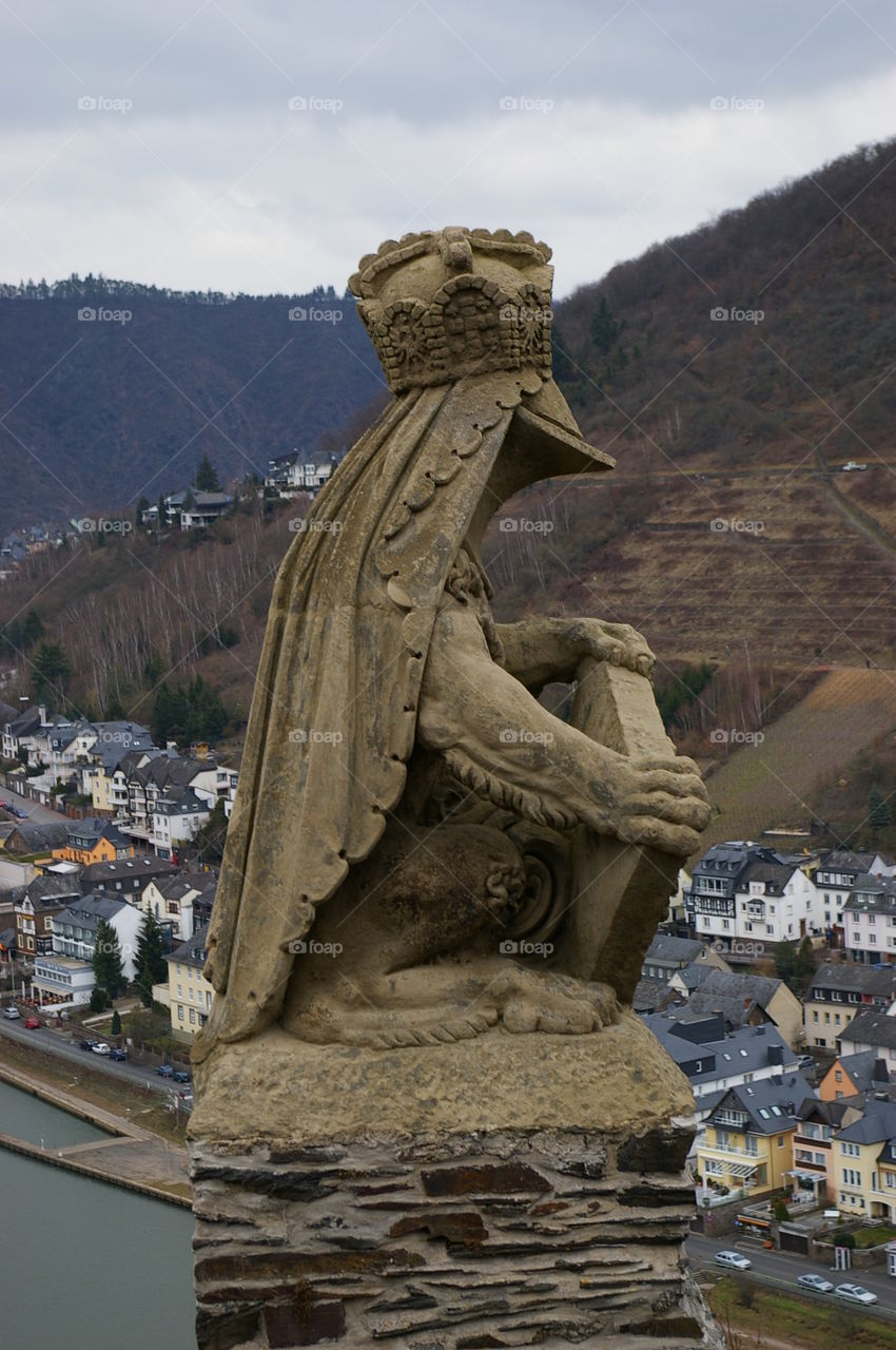 Statue on a castle ledge 