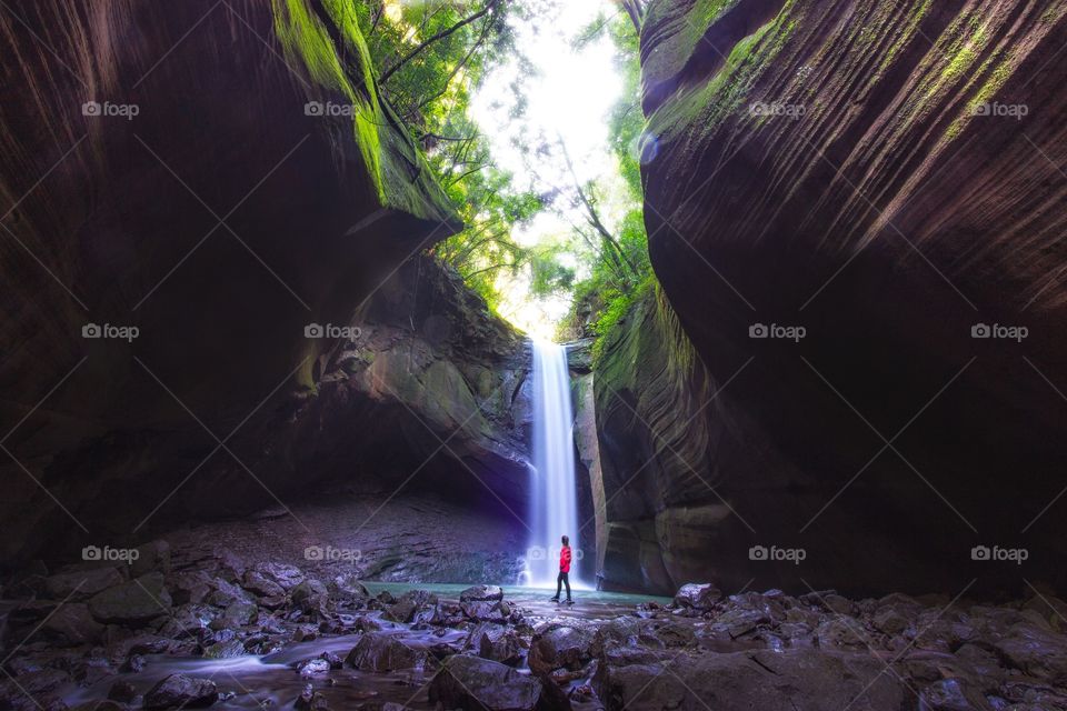 Girl looking at the cascade