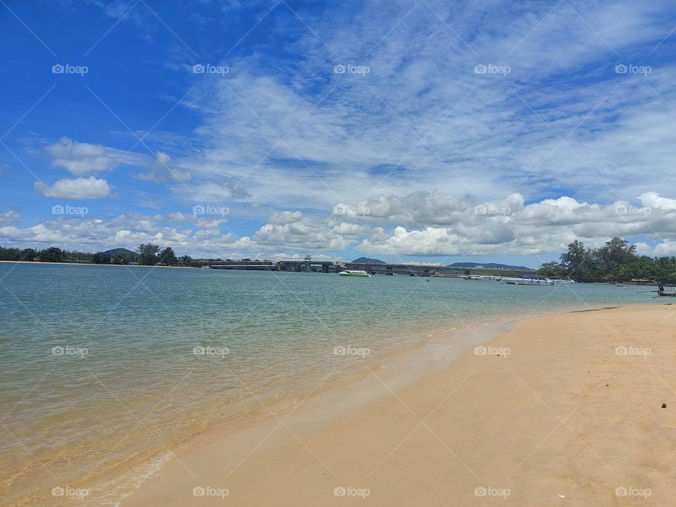Sky,send, blue,sea, clouds, trees