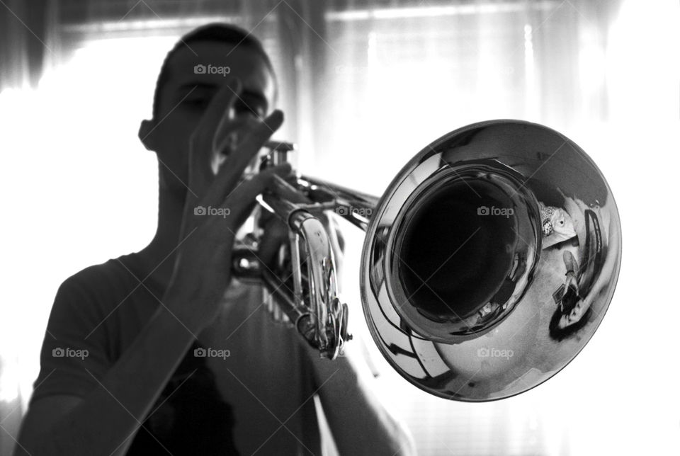 A trumpet player in monochrome