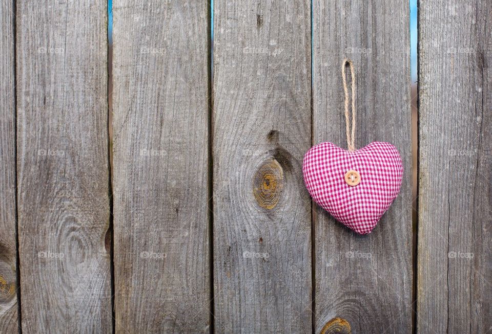 Heart hanging on wood