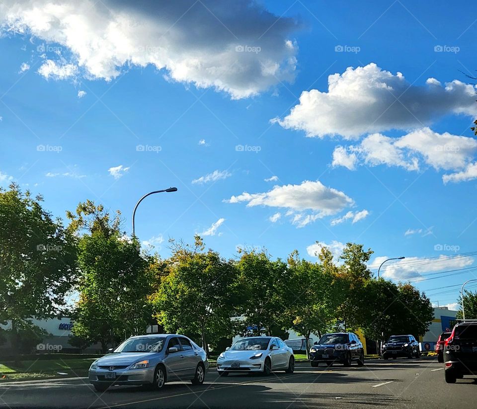 view of on-coming commuter traffic line of cars on a week day August evening in Oregon