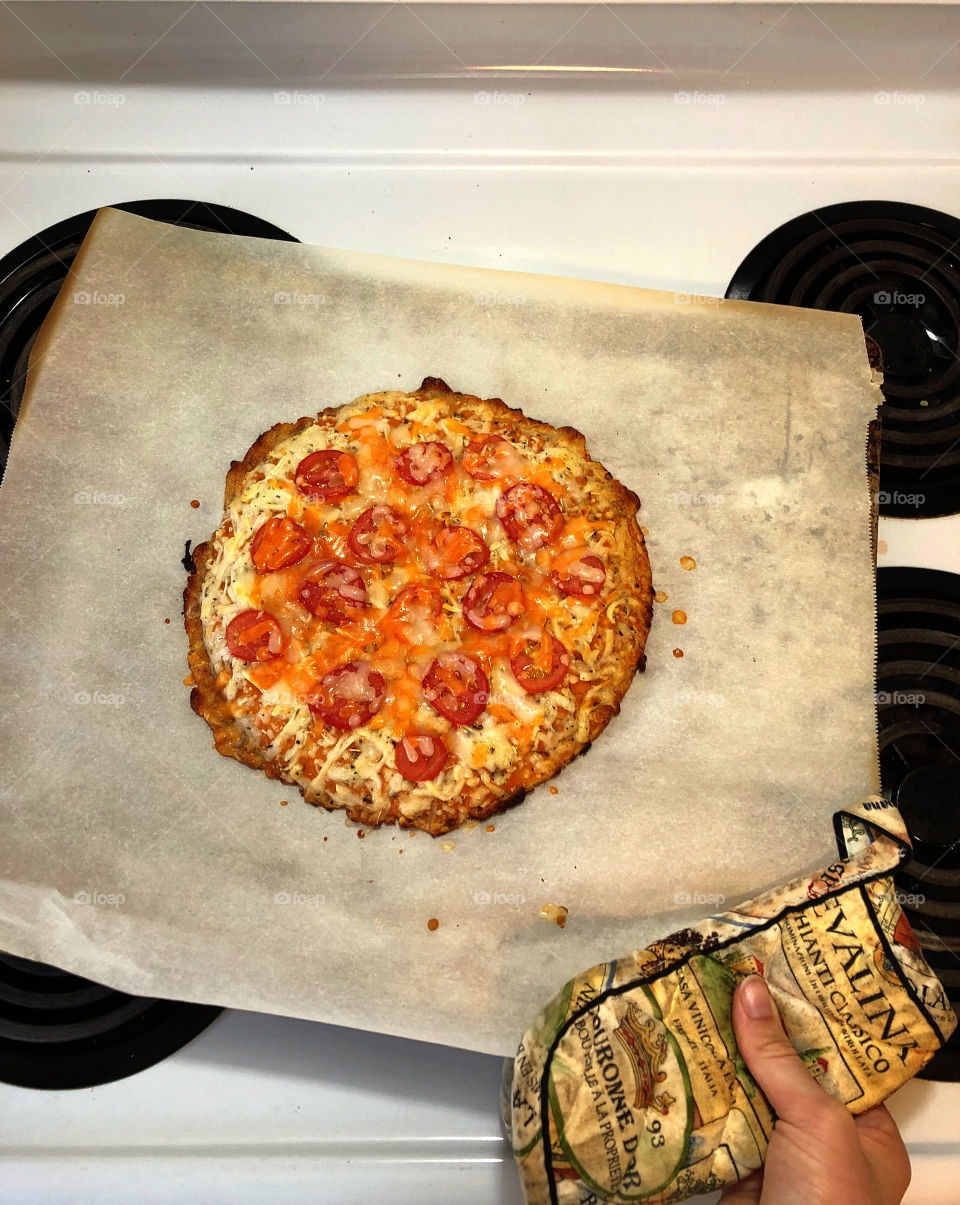 A fresh pizza right out of the oven.