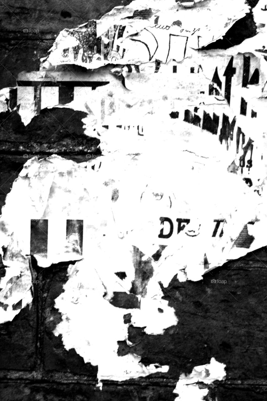 Torn apart by weather . Ripped and torn posters 