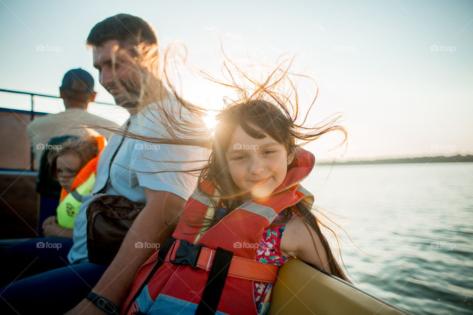 Funny girl portrait in a boat