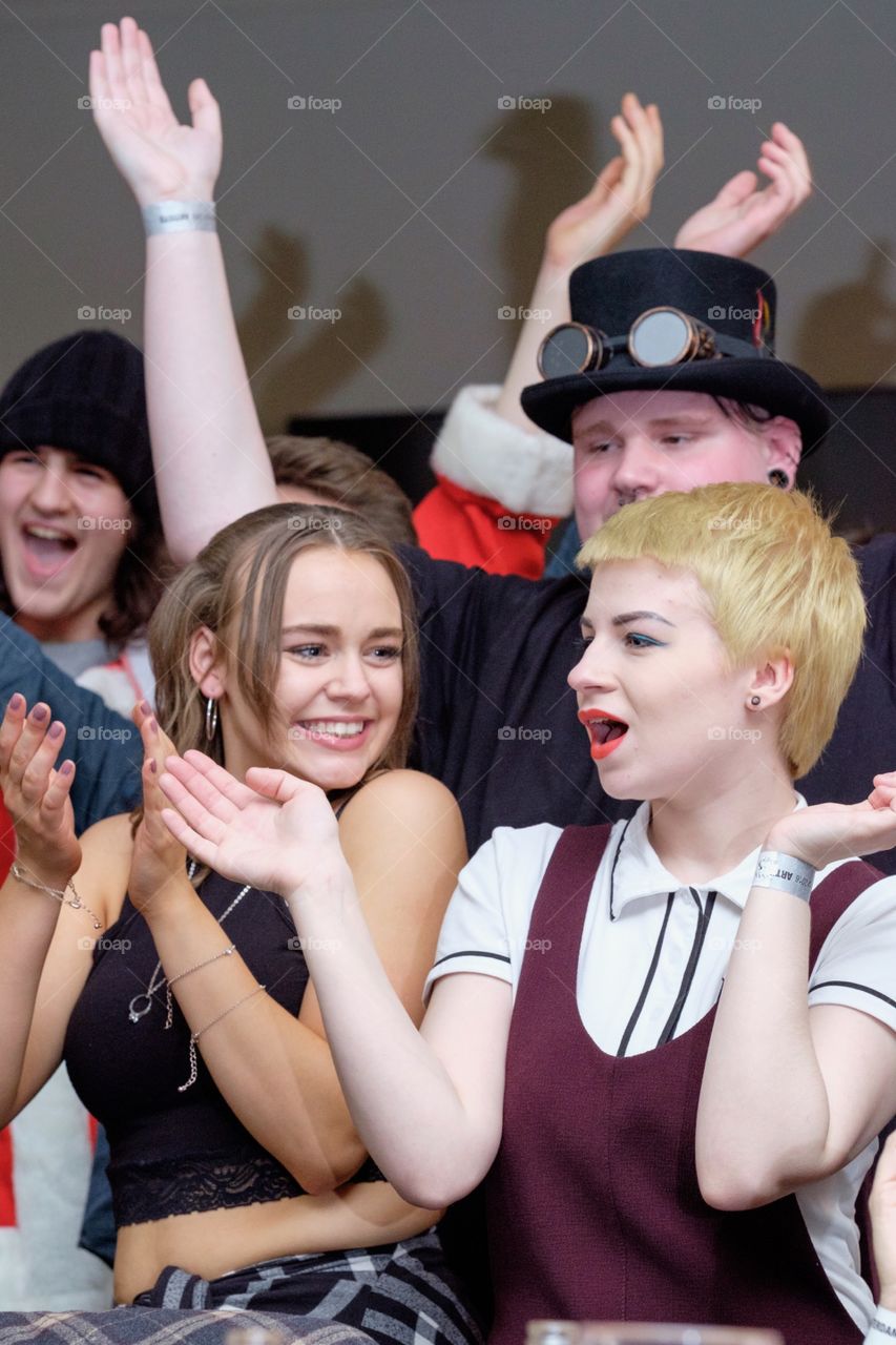 Young people having fun at music gig