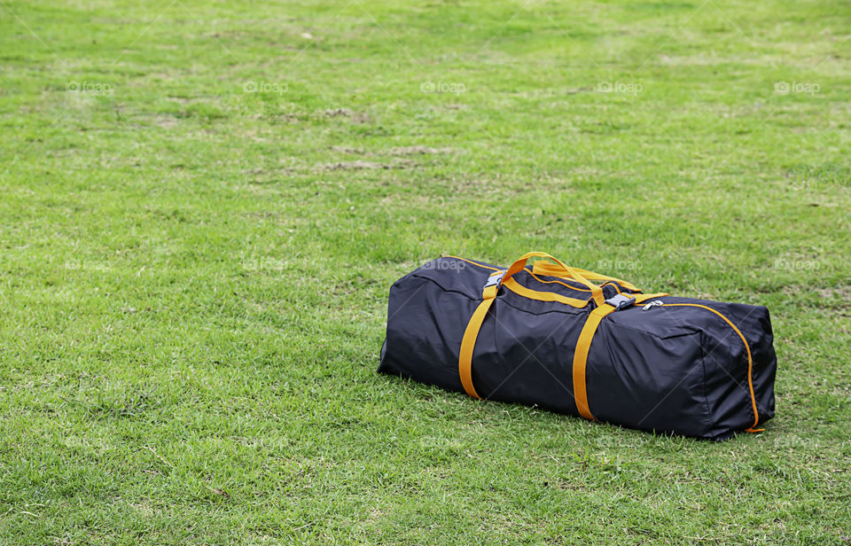 Backpack tents on the lawn.