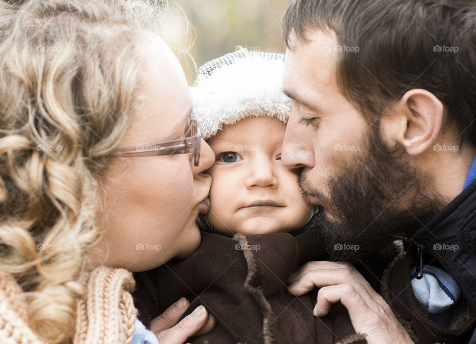 Happy family-mother, father and son  baby boy