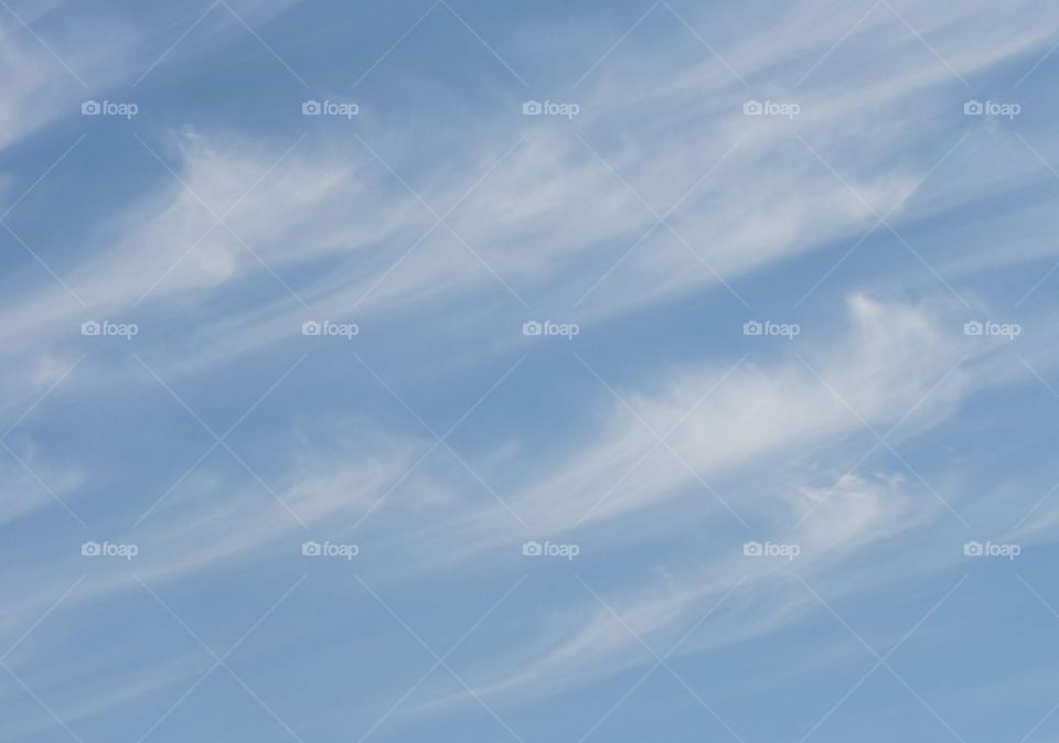 Blue sky with wispy clouds