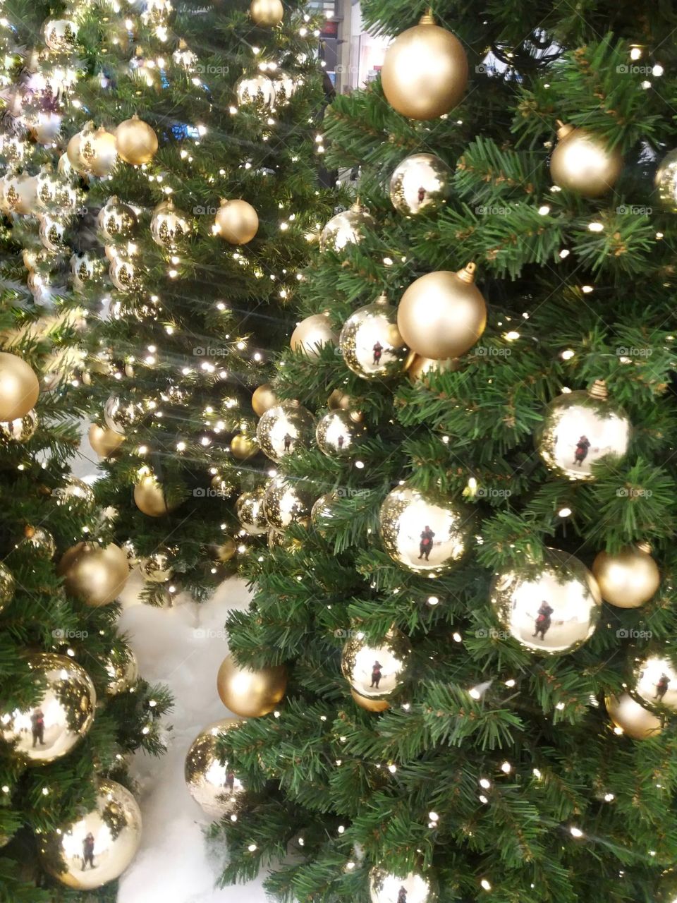 close- up of Christmas tree decorated with golden bubbles