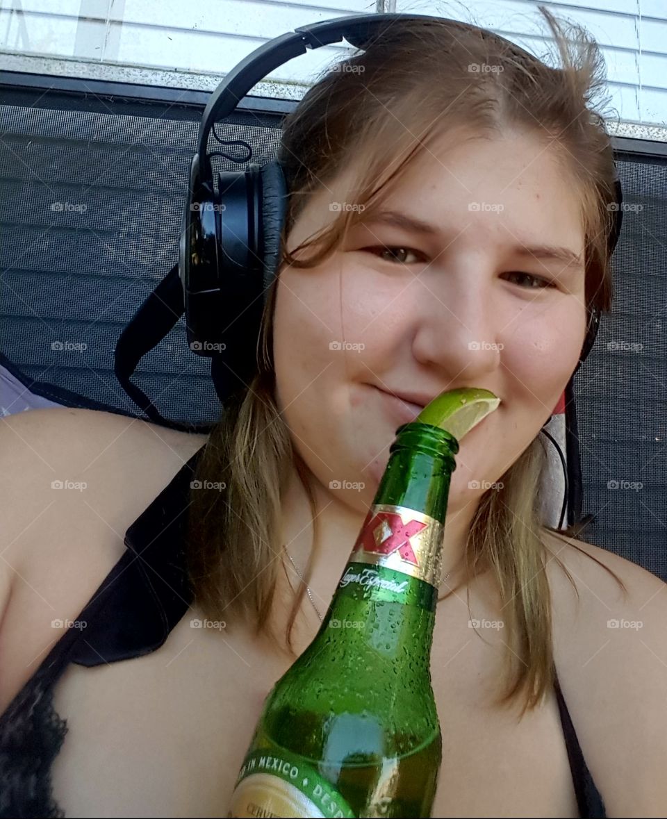 This was me on the best day I'd had in a long time in August of this year, 2018 enjoying a dressed dos equis and my favorite playlist on spotify.