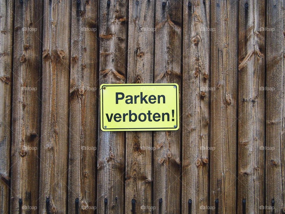 prohibited parking label or no parking in Germany and wooden background