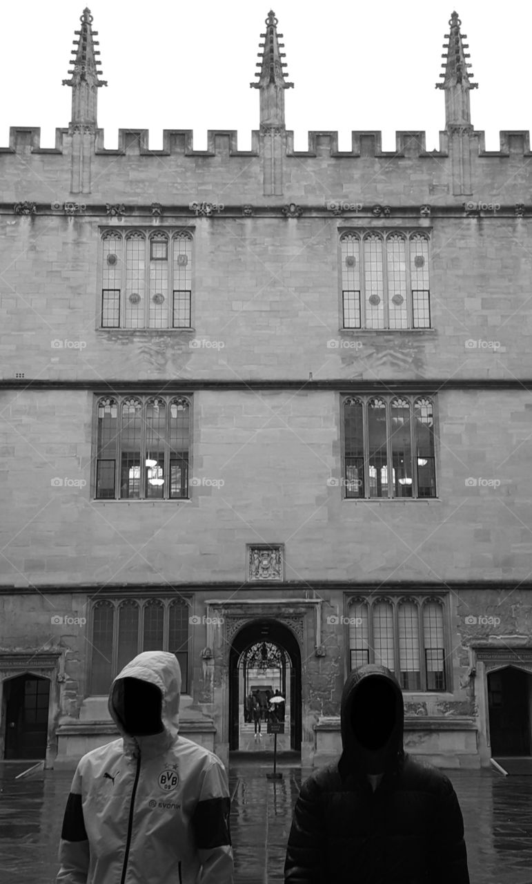 two men mysterious framed while I took a photo to a architecture