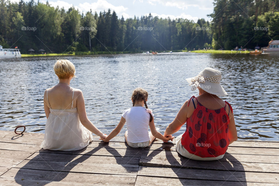 Family enjoying weekend at the lake. 3 generations.