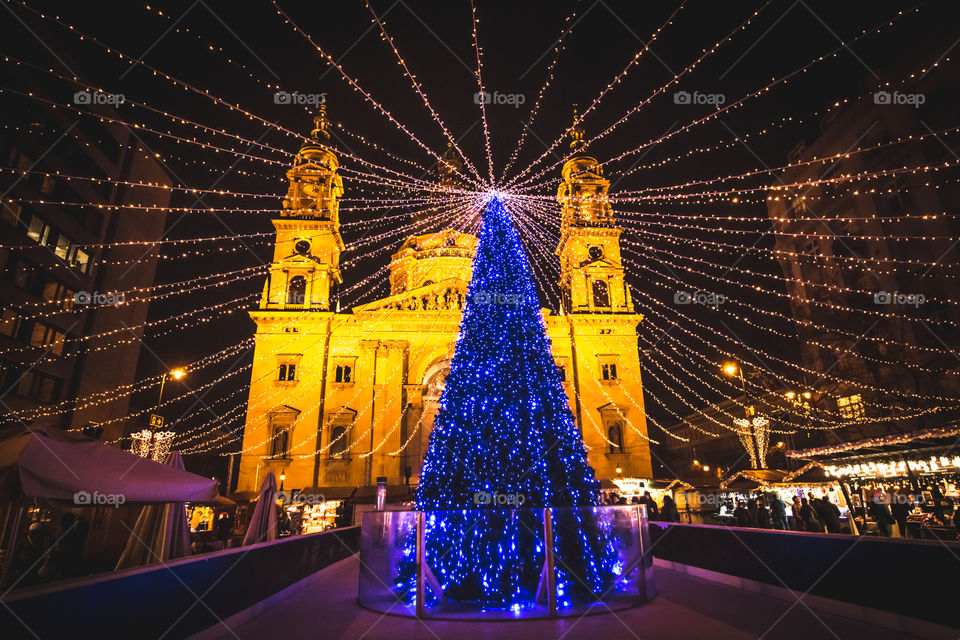 Illuminated blue christmas tree with blue lights