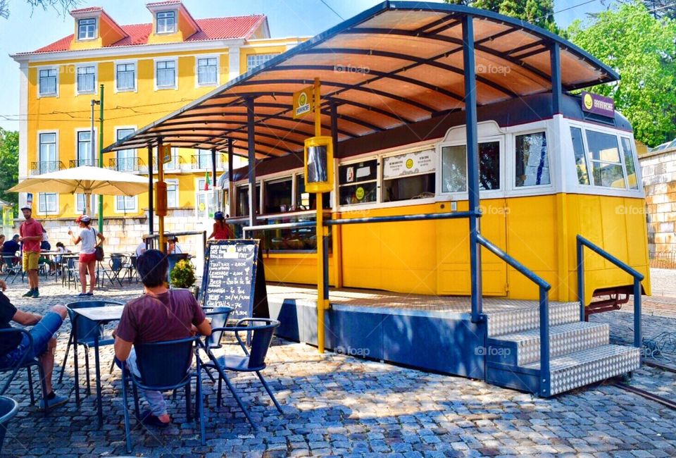 Beverages served from a traditional yellow tram of Lisbon 